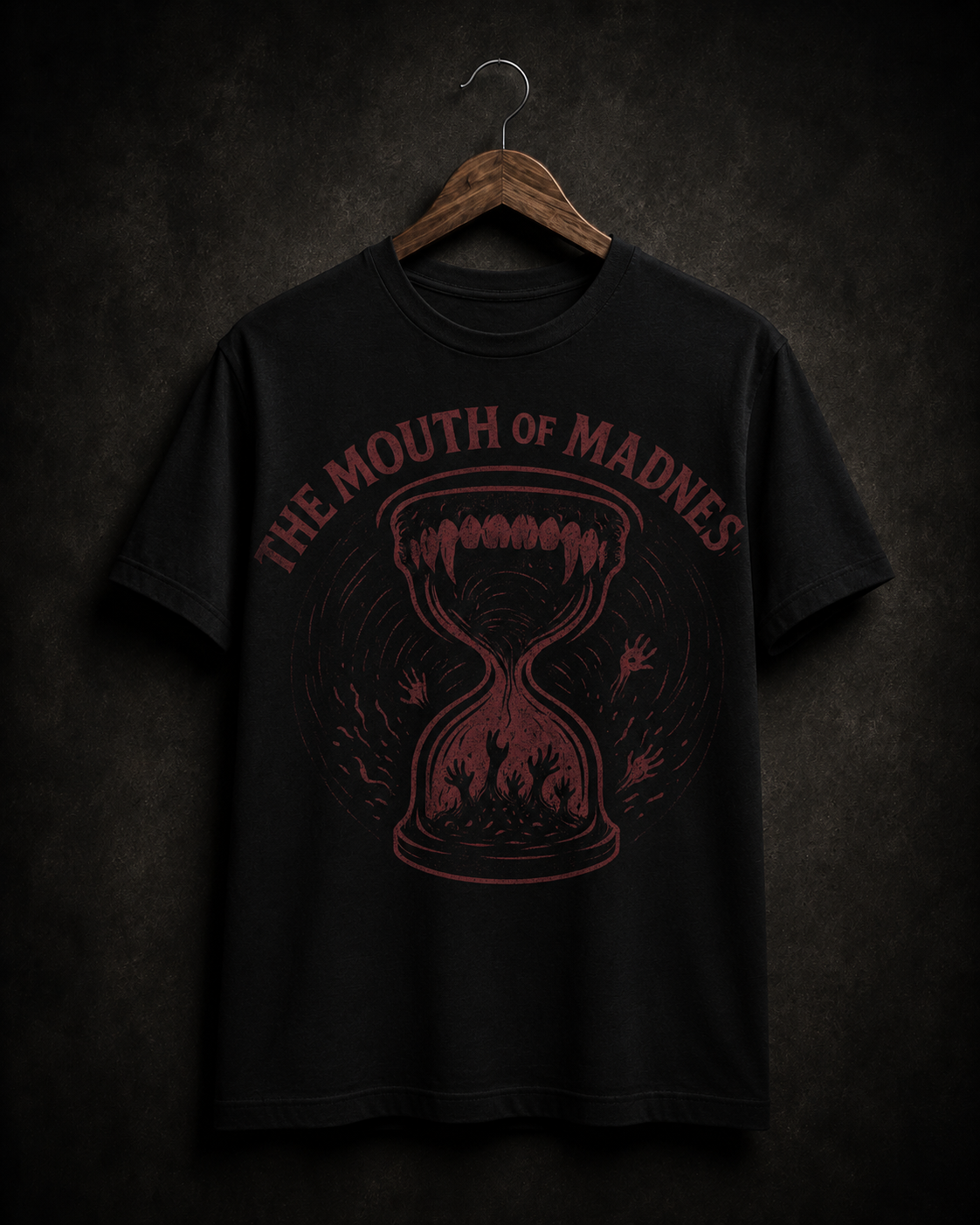 The Mouth of Madness T-shirt on a wooden hanger